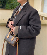 Manteau en laine capuche modulable